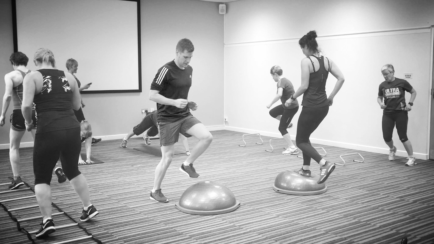 Group fitness training with balance equipment